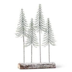 snowy | tall trees on log base